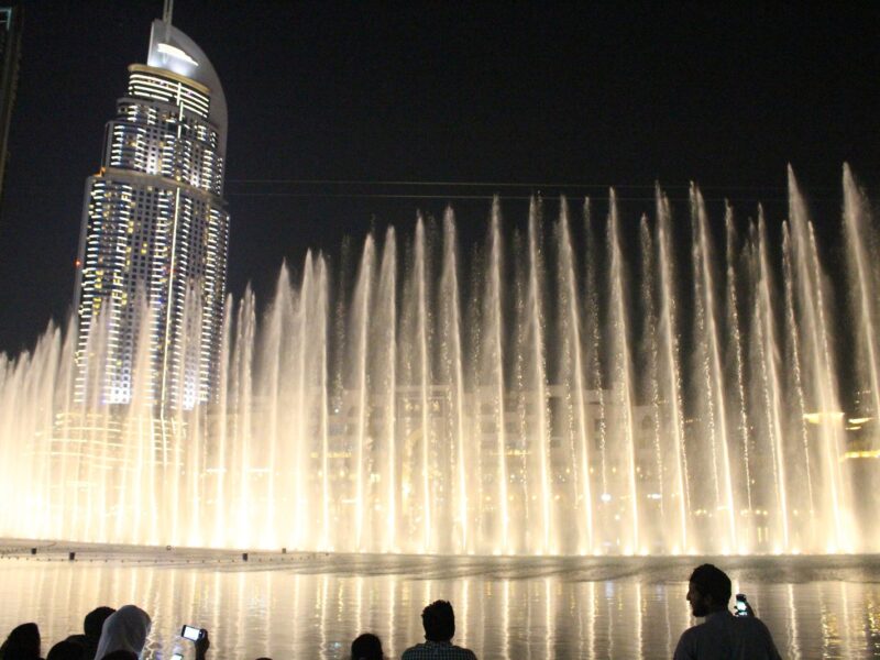 The Dubai Fountain and the Address Downtown tower at night