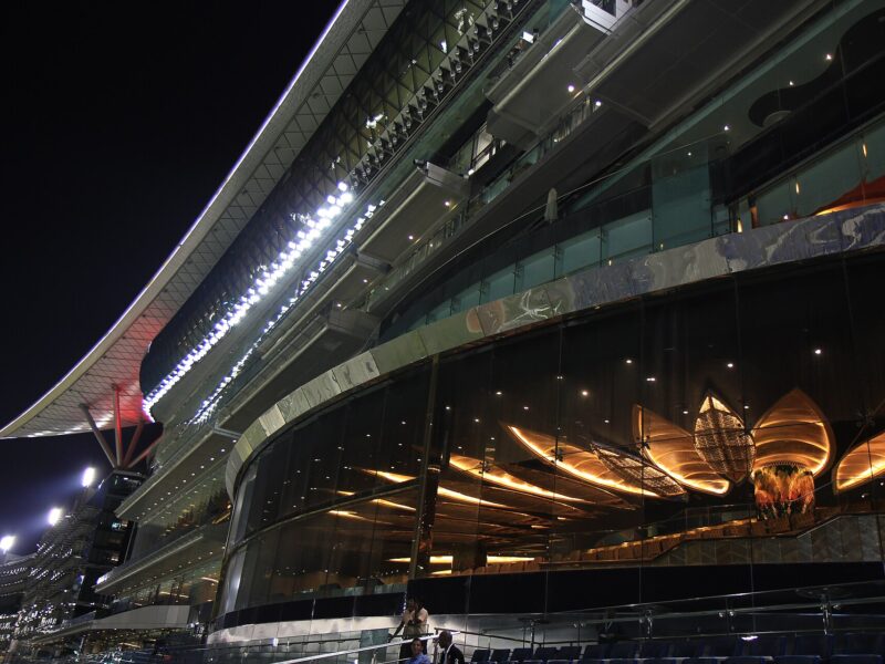 Meydan Racecourse grandstand at night, Dubai